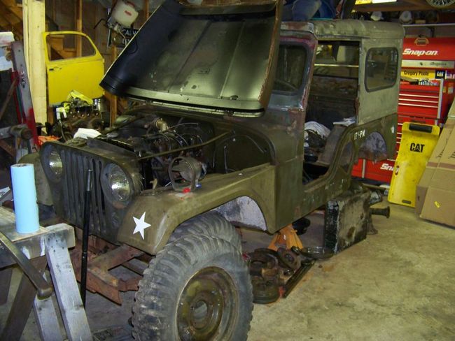 working on Jeep in Garage