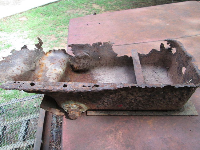 Rusted_out_riveted_drain_oil_pan