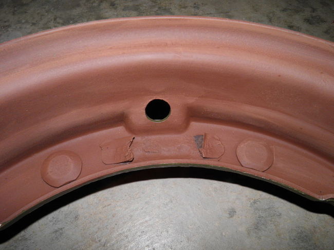 Combat rim damaged caution plate