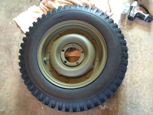 Restored combat rim with Goodyear tire